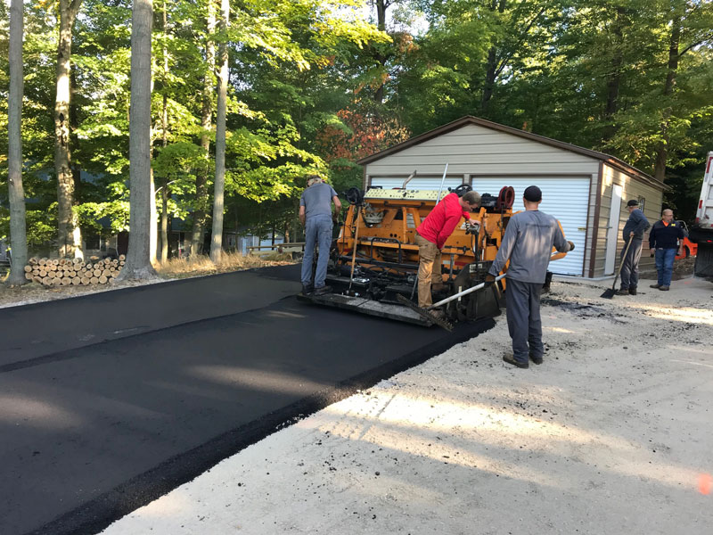 paving machine paving residential driveway